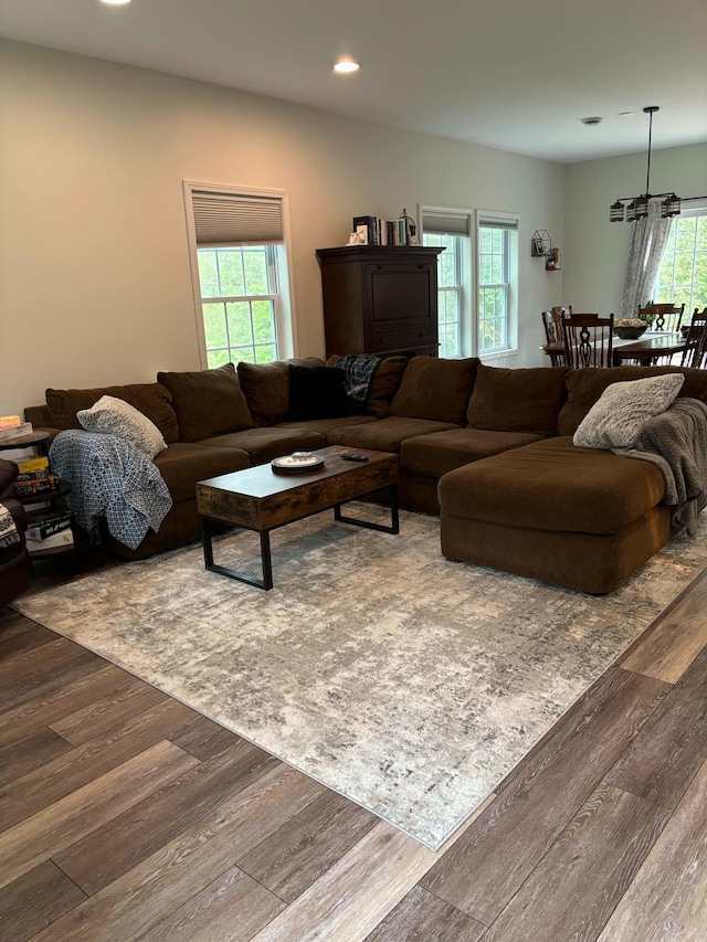 living area with recessed lighting and wood finished floors