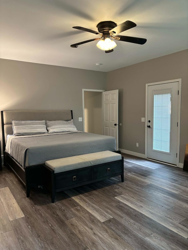 bedroom with wood finished floors, baseboards, and ceiling fan