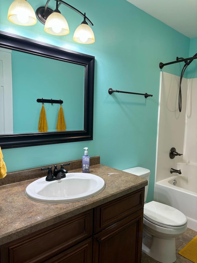 full bath featuring vanity, tile patterned floors, toilet, and shower / bathtub combination