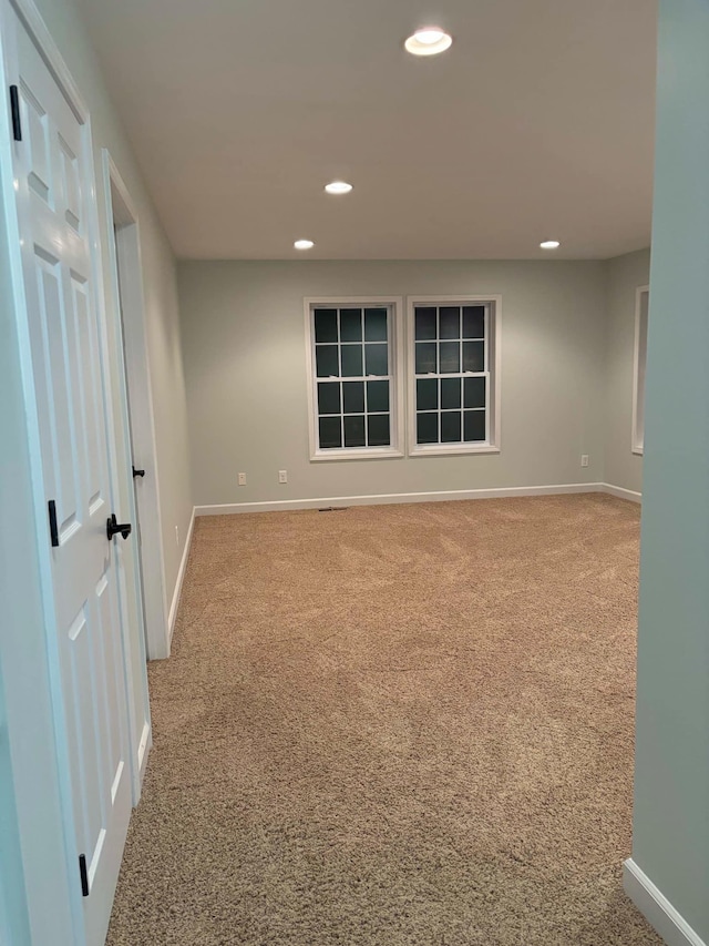 carpeted spare room with recessed lighting and baseboards