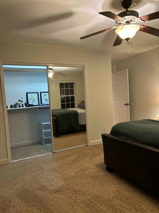 carpeted bedroom with baseboards and ceiling fan