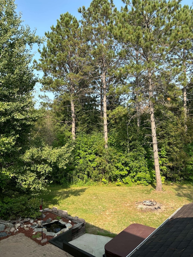 view of yard with an outdoor fire pit