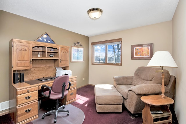 office with baseboards, visible vents, and dark carpet