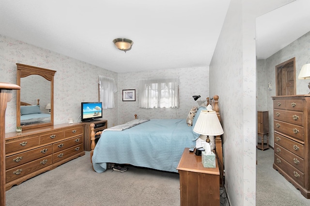 carpeted bedroom with wallpapered walls