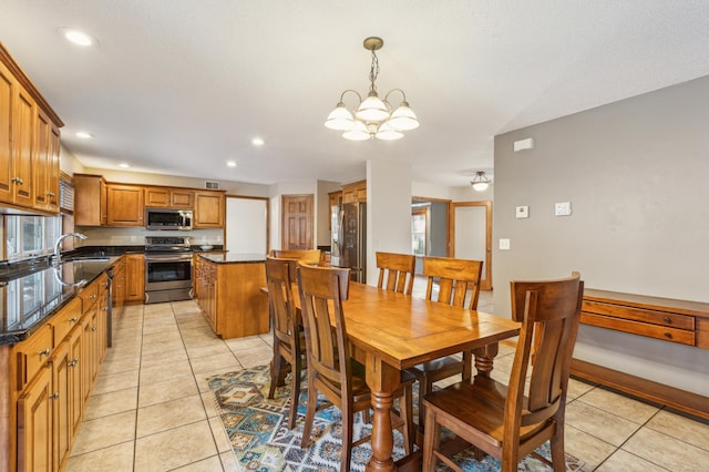 dining room with light tile patterned floors, a notable chandelier, and recessed lighting