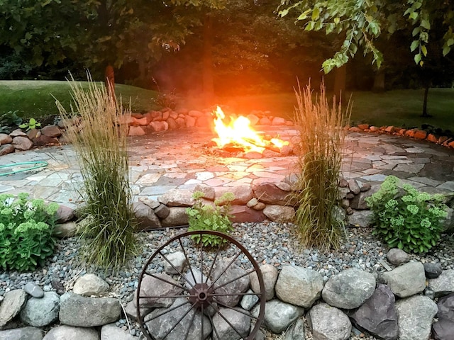 exterior space with a patio and a small pond