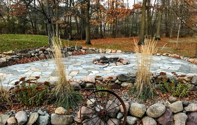 exterior space with an outdoor fire pit