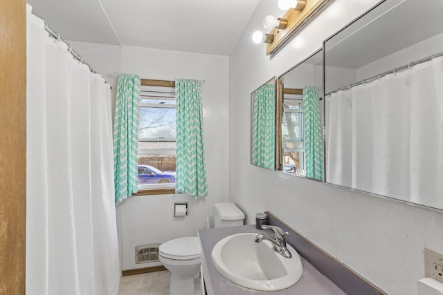 full bathroom featuring tile patterned floors, visible vents, toilet, and vanity