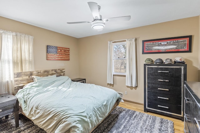 bedroom featuring light wood-style floors and ceiling fan