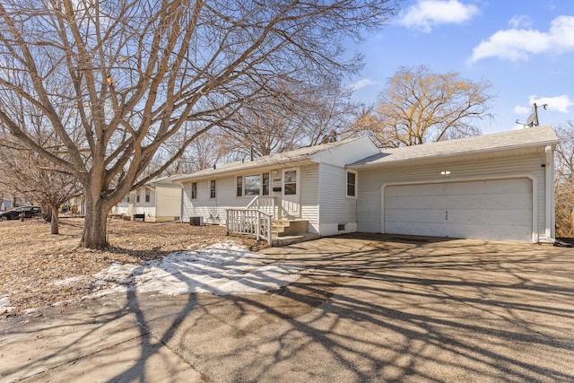 single story home with an attached garage and driveway