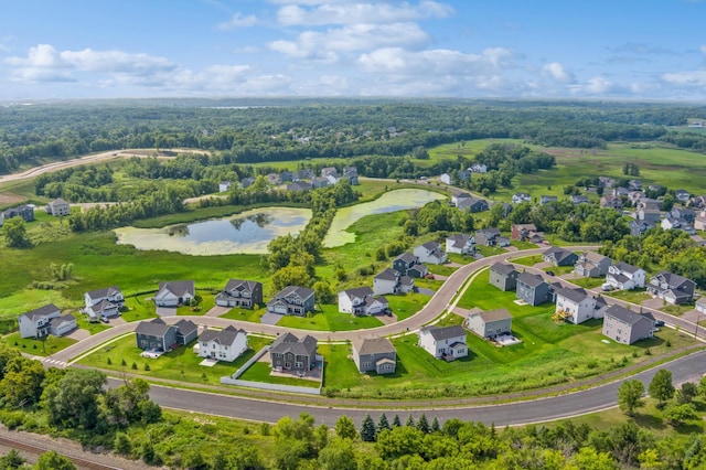 bird's eye view featuring a residential view and a water view