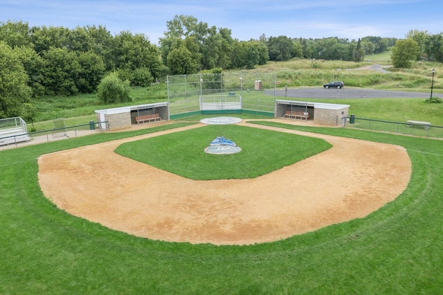 surrounding community with an outbuilding, a lawn, and fence