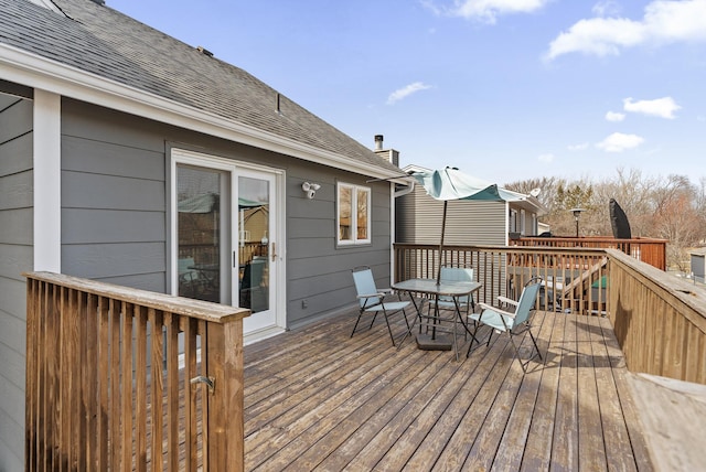 deck featuring outdoor dining area