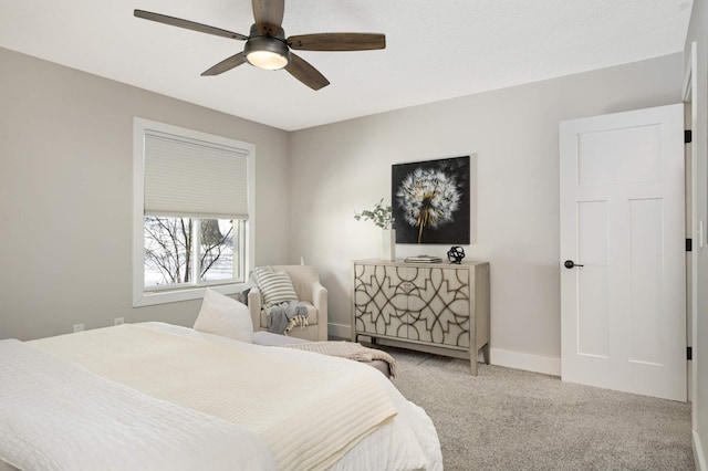 bedroom with carpet flooring, a ceiling fan, and baseboards