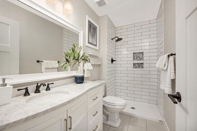 full bath with vanity, visible vents, a stall shower, tile patterned floors, and toilet