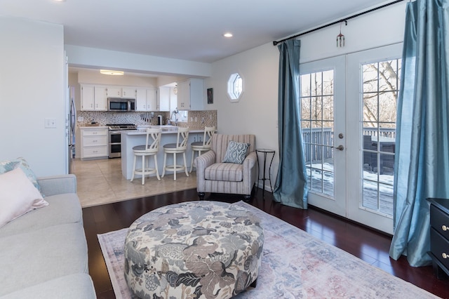 living room featuring wood finished floors and french doors