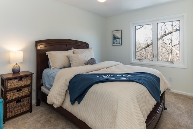 carpeted bedroom with baseboards