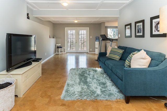 living room with beamed ceiling, french doors, and baseboards