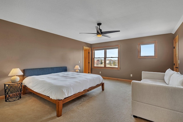 bedroom with carpet flooring, a ceiling fan, and baseboards