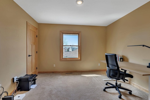 office with baseboards and carpet floors