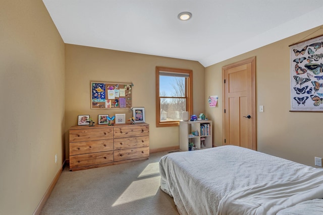 bedroom with carpet flooring and baseboards