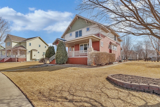 view of property exterior featuring a yard and covered porch