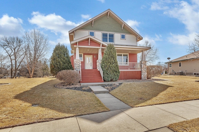 craftsman house featuring a porch and a front yard