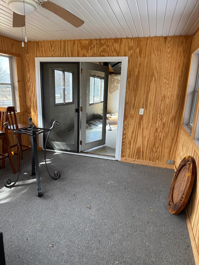 doorway to property featuring ceiling fan