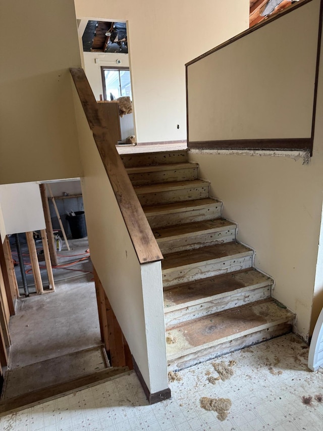 staircase with tile patterned floors