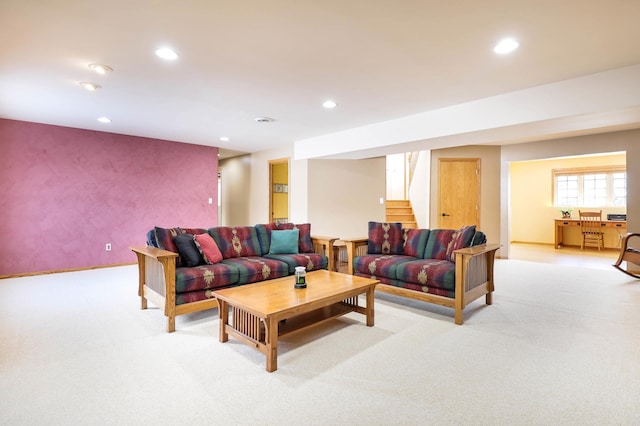 living area with light carpet, recessed lighting, stairs, and baseboards