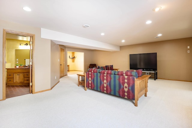 living room with recessed lighting, baseboards, and carpet floors