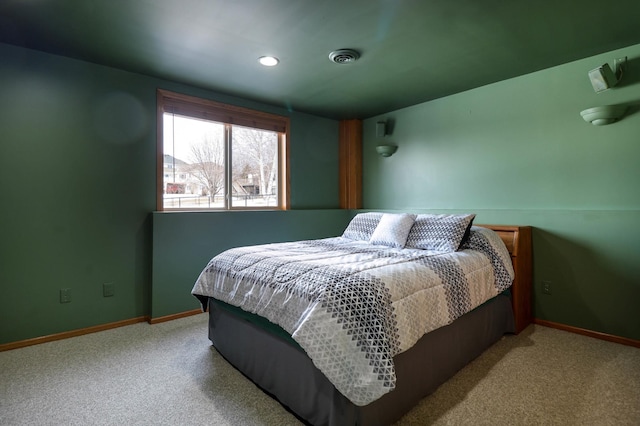 bedroom with carpet flooring, visible vents, and baseboards