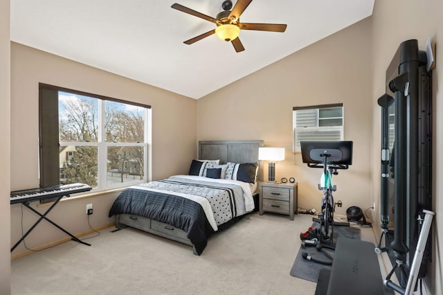 carpeted bedroom with lofted ceiling and a ceiling fan