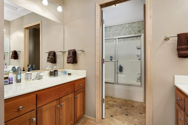 full bathroom featuring vanity and enclosed tub / shower combo