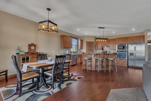 dining room with recessed lighting, a chandelier, baseboards, and dark wood-style floors