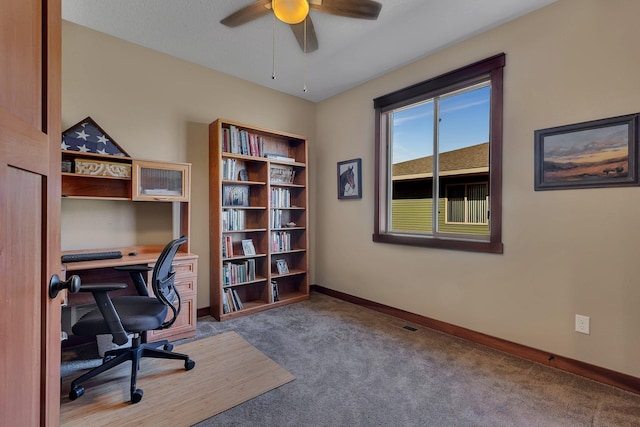 office area featuring baseboards, carpet floors, and ceiling fan