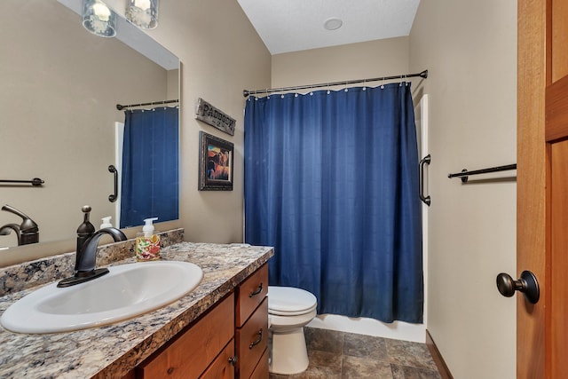 bathroom with toilet and vanity