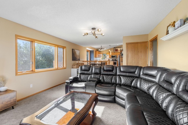 carpeted living room with baseboards, a chandelier, and a textured ceiling