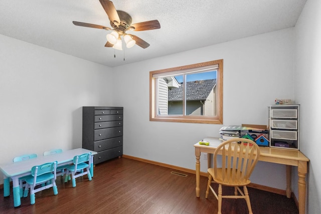 office area featuring visible vents, baseboards, wood finished floors, a textured ceiling, and a ceiling fan