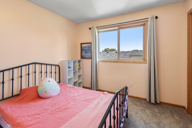 bedroom featuring baseboards and carpet floors