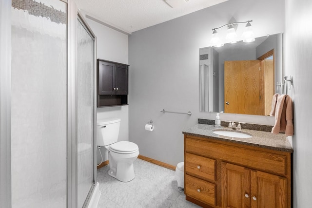 full bath featuring baseboards, toilet, a stall shower, and vanity