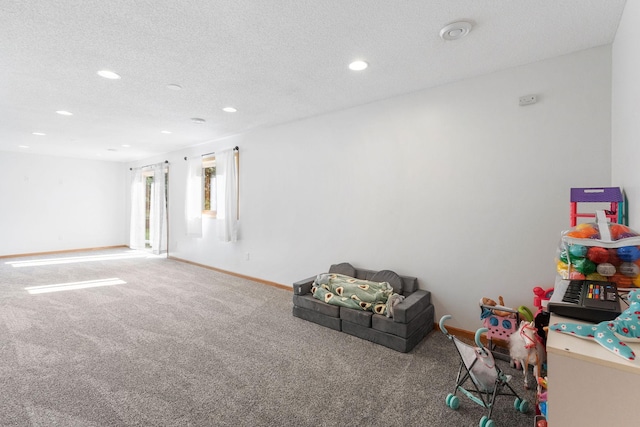 playroom featuring carpet flooring, recessed lighting, a textured ceiling, and baseboards