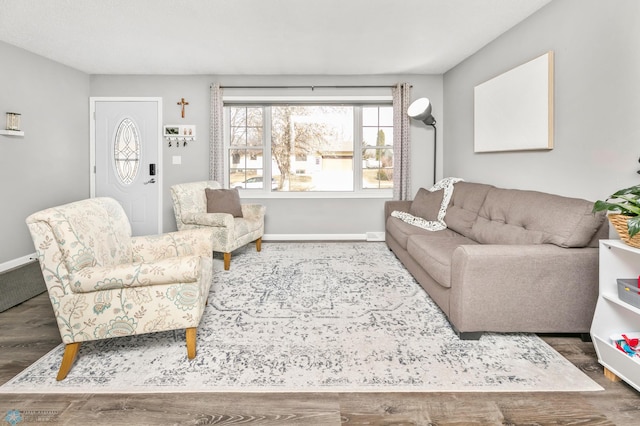 living room featuring baseboards and wood finished floors