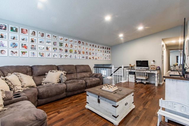 living room with recessed lighting and dark wood-type flooring