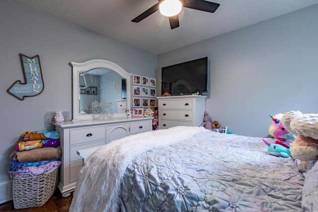 bedroom featuring dark wood-style floors and ceiling fan