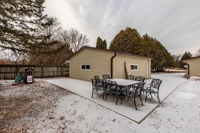 exterior space with outdoor dining space, a patio area, and fence