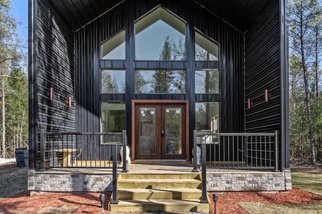 doorway to property with french doors and stone siding