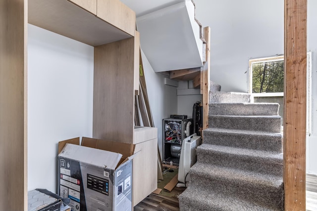 stairway with wood finished floors