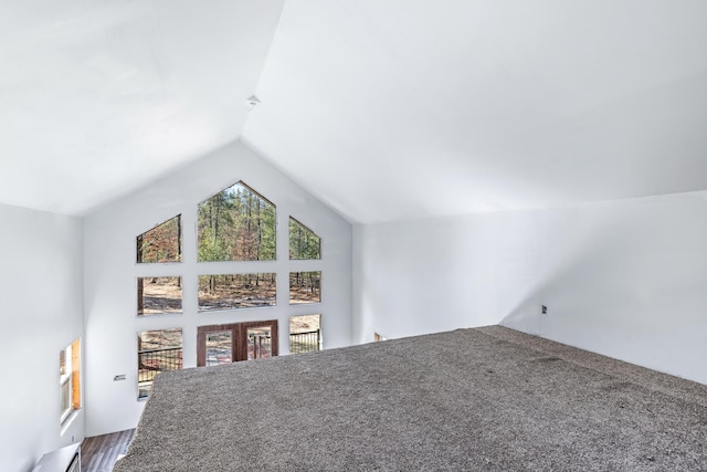 bonus room featuring lofted ceiling and baseboard heating