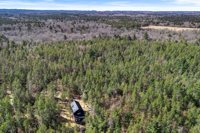 drone / aerial view featuring a forest view